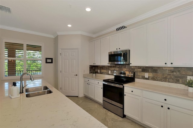 10789 Tarflower Dr Unit 202, Venice, FL 34293 - kitchen featuring stainless steel appliances, ornamental molding, decorative backsplash, white cabinets, and recessed lighting