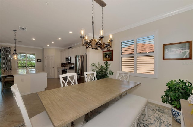 10789 Tarflower Dr Unit 202, Venice, FL 34293 - dining space with crown molding, a chandelier, and recessed lighting