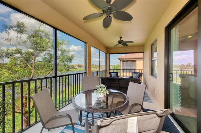 10789 Tarflower Dr Unit 202, Venice, FL 34293 - sunroom with a ceiling fan, a water view, and outdoor dining space