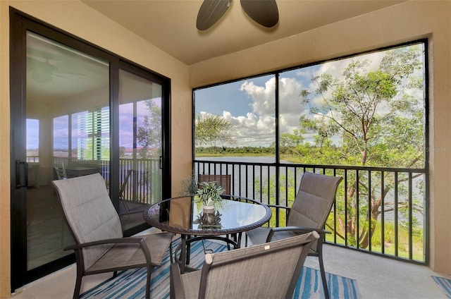 10789 Tarflower Dr Unit 202, Venice, FL 34293 - sunroom featuring a ceiling fan, a water view, and outdoor dining space