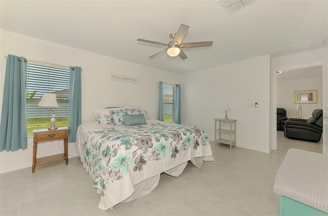 137 Hercules Dr, Rotonda West, FL 33947 - bedroom with baseboards, ceiling fan, and light tile patterned floors
