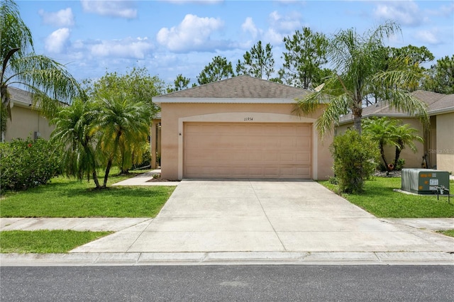 11954 Tempest Harbor Loop, Venice, FL 34292 - single story home with stucco siding, a front yard, concrete driveway, and an attached garage