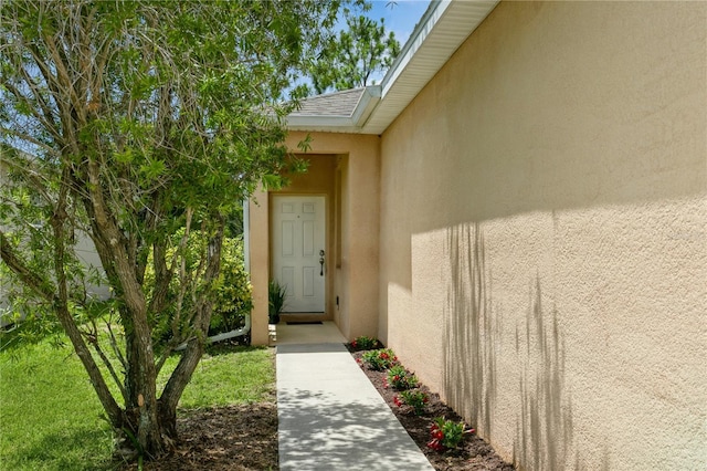 11954 Tempest Harbor Loop, Venice, FL 34292 - doorway to property with stucco siding