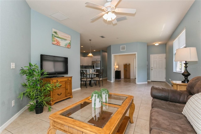 11954 Tempest Harbor Loop, Venice, FL 34292 - living area with light tile patterned floors and ceiling fan