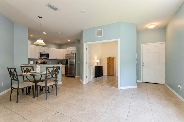 11954 Tempest Harbor Loop, Venice, FL 34292 - dining area with light tile patterned flooring and recessed lighting