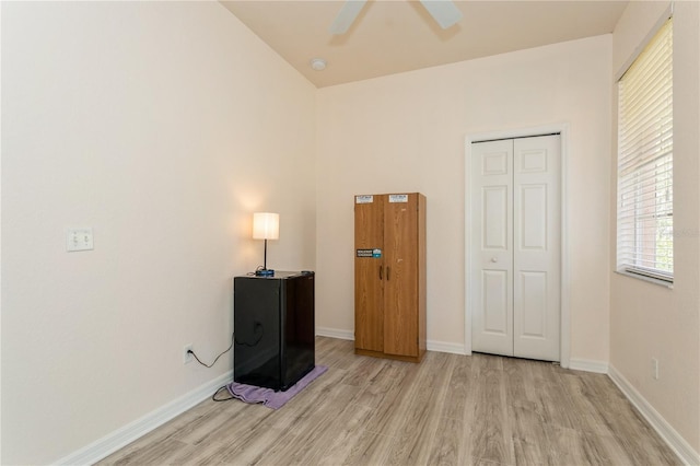 11954 Tempest Harbor Loop, Venice, FL 34292 - bedroom featuring light wood-style flooring, a closet, and a ceiling fan