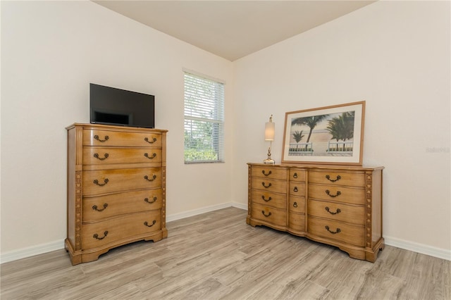 11954 Tempest Harbor Loop, Venice, FL 34292 - bedroom featuring light wood finished floors and baseboards