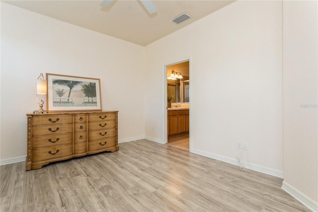 11954 Tempest Harbor Loop, Venice, FL 34292 - bedroom featuring light wood-type flooring, ensuite bath, and a ceiling fan