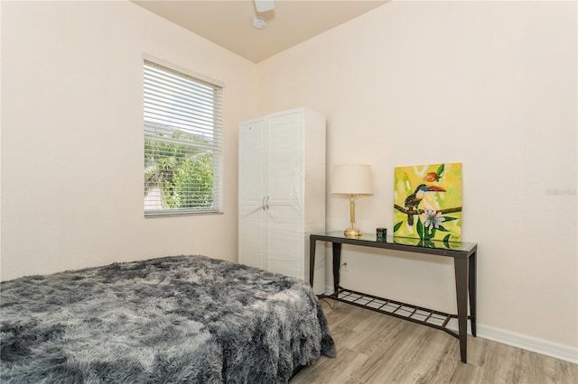 11954 Tempest Harbor Loop, Venice, FL 34292 - bedroom featuring light wood-style flooring and baseboards
