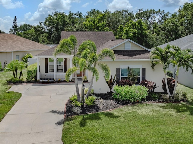 6505 Meandering Way, Lakewood Ranch, FL 34202 - view of front of house featuring concrete driveway, stucco siding, a shingled roof, covered porch, and a front lawn