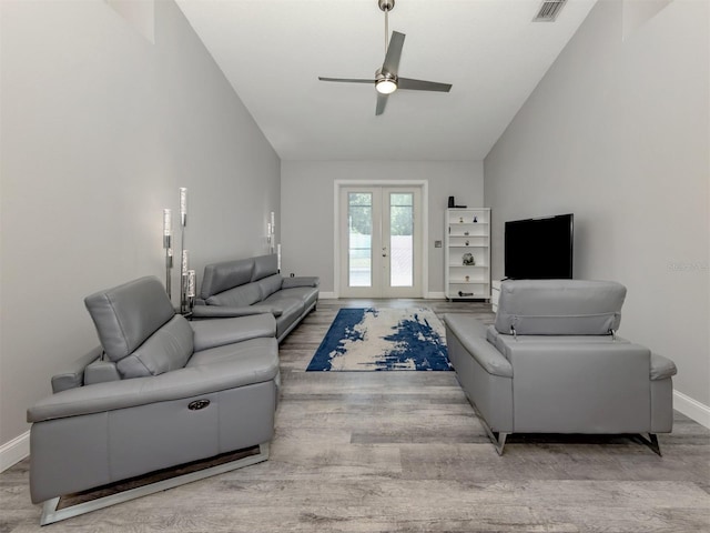 6505 Meandering Way, Lakewood Ranch, FL 34202 - living area with wood finished floors, lofted ceiling, a ceiling fan, and french doors