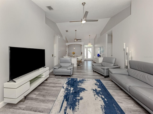 6505 Meandering Way, Lakewood Ranch, FL 34202 - living room featuring a ceiling fan, wood finished floors, and lofted ceiling