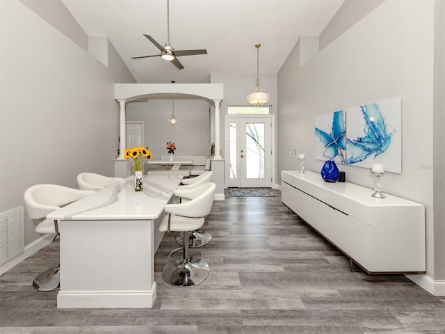 6505 Meandering Way, Lakewood Ranch, FL 34202 - entryway featuring vaulted ceiling, arched walkways, decorative columns, a ceiling fan, and wood finished floors