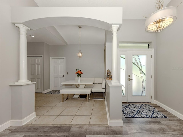 6505 Meandering Way, Lakewood Ranch, FL 34202 - foyer with ornate columns and light wood finished floors