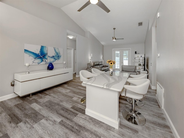 6505 Meandering Way, Lakewood Ranch, FL 34202 - living area with a ceiling fan, lofted ceiling, light wood-type flooring, and french doors