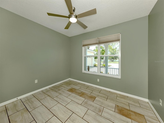 6505 Meandering Way, Lakewood Ranch, FL 34202 - empty room with ceiling fan, a textured ceiling, and tile patterned floors