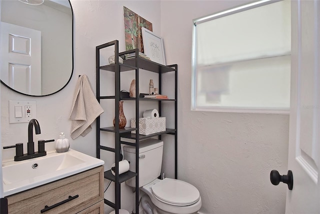 3340 Webber St, Sarasota, FL 34239 - bathroom featuring vanity, toilet, and a textured wall
