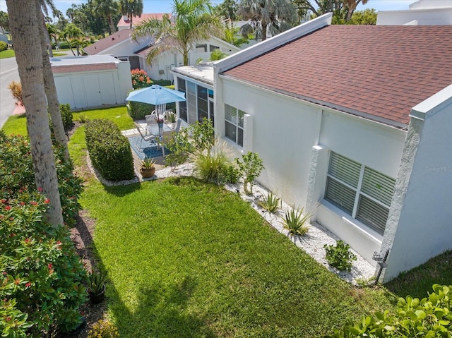 751 Capri Isles Blvd Unit 108, Venice, FL 34292 - view of green lawn with a patio area