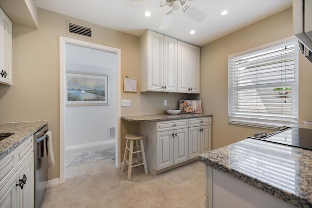 751 Capri Isles Blvd Unit 108, Venice, FL 34292 - kitchen featuring ceiling fan, light stone counters, white cabinetry, dishwasher, and recessed lighting