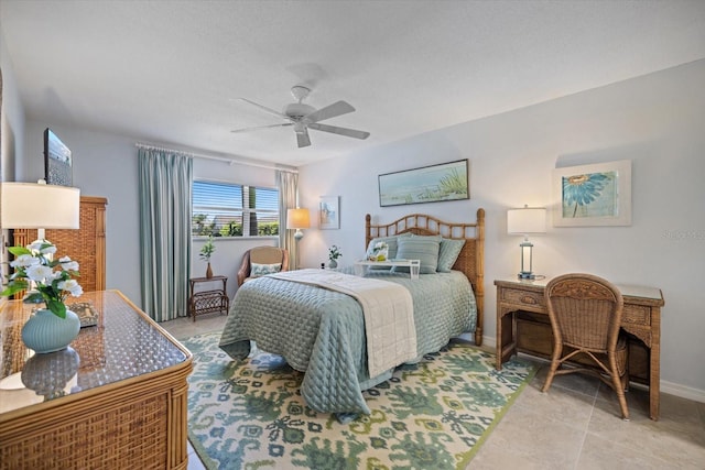 751 Capri Isles Blvd Unit 108, Venice, FL 34292 - bedroom with baseboards, ceiling fan, and light tile patterned flooring