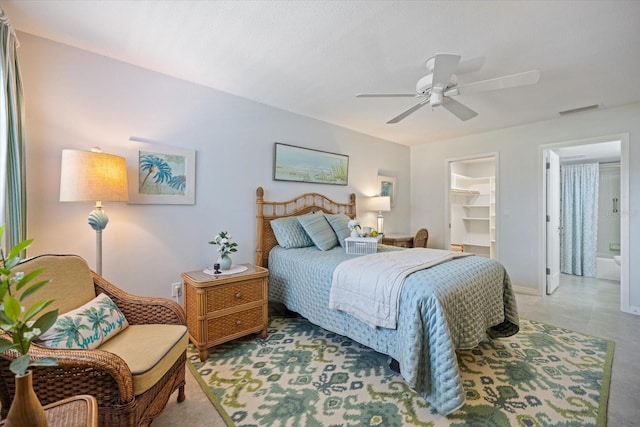 751 Capri Isles Blvd Unit 108, Venice, FL 34292 - bedroom with a spacious closet, a ceiling fan, and a closet