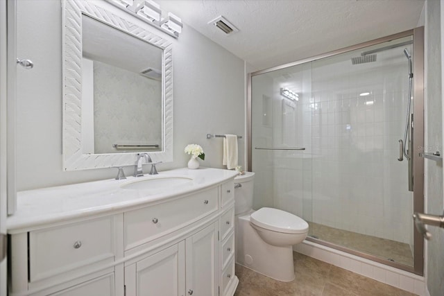 751 Capri Isles Blvd Unit 108, Venice, FL 34292 - full bath with toilet, a shower stall, vanity, tile patterned flooring, and a textured ceiling