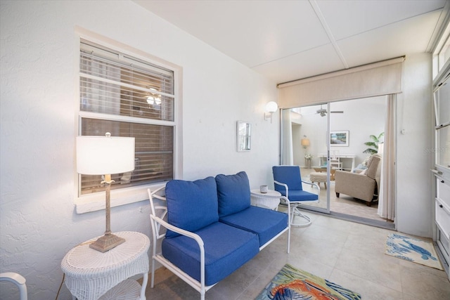 751 Capri Isles Blvd Unit 108, Venice, FL 34292 - sunroom / solarium with an outdoor hangout area and a ceiling fan