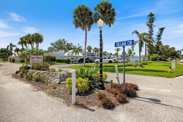 751 Capri Isles Blvd Unit 108, Venice, FL 34292 - community / neighborhood sign with a lawn