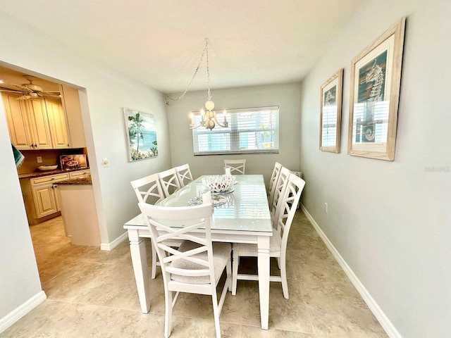 751 Capri Isles Blvd Unit 108, Venice, FL 34292 - dining area featuring a chandelier and baseboards