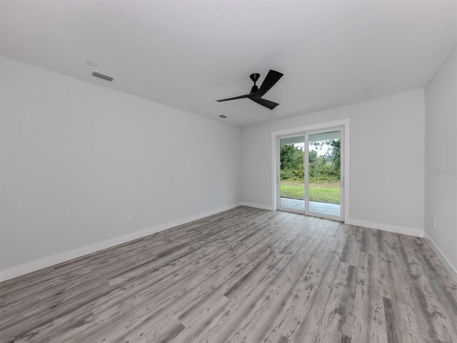 137 Mariner Ln, Rotonda West, FL 33947 - spare room with wood finished floors, a ceiling fan, and baseboards