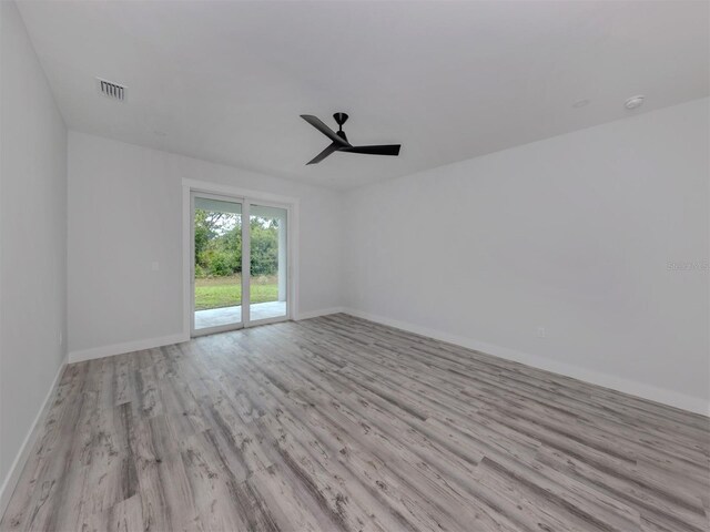 137 Mariner Ln, Rotonda West, FL 33947 - empty room featuring wood finished floors, baseboards, and ceiling fan
