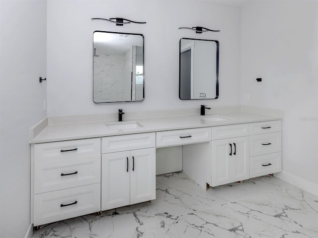 137 Mariner Ln, Rotonda West, FL 33947 - full bathroom featuring double vanity, marble finish floors, and baseboards