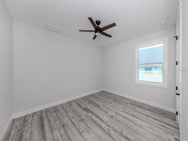 137 Mariner Ln, Rotonda West, FL 33947 - empty room featuring wood finished floors, ceiling fan, and baseboards