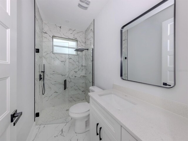 137 Mariner Ln, Rotonda West, FL 33947 - full bath featuring marble look tiles, a marble finish shower, vanity, and toilet