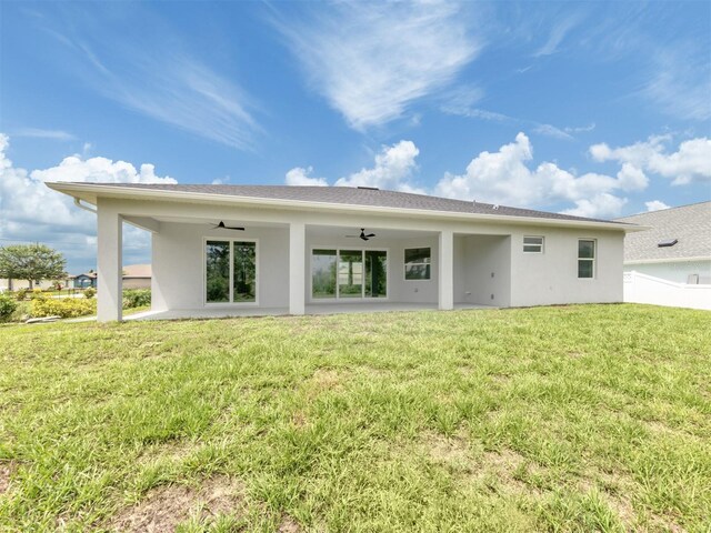 137 Mariner Ln, Rotonda West, FL 33947 - rear view of house with ceiling fan, stucco siding, and a patio area