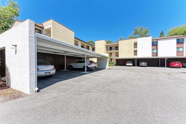 2718 Orchid Oaks Dr Unit C-202, Sarasota, FL 34239 - view of covered parking lot
