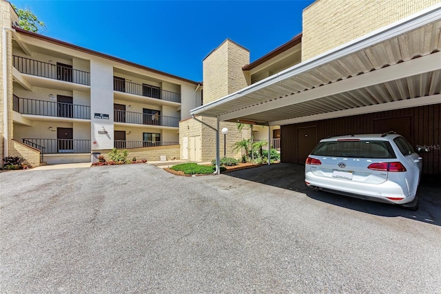 2718 Orchid Oaks Dr Unit C-202, Sarasota, FL 34239 - view of covered parking lot