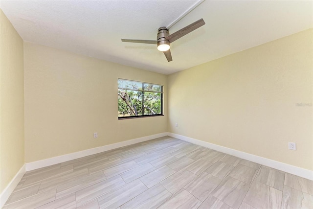 2718 Orchid Oaks Dr Unit C-202, Sarasota, FL 34239 - empty room featuring a ceiling fan and baseboards