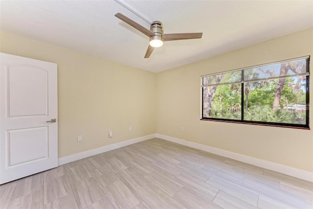 2718 Orchid Oaks Dr Unit C-202, Sarasota, FL 34239 - spare room with ceiling fan and baseboards