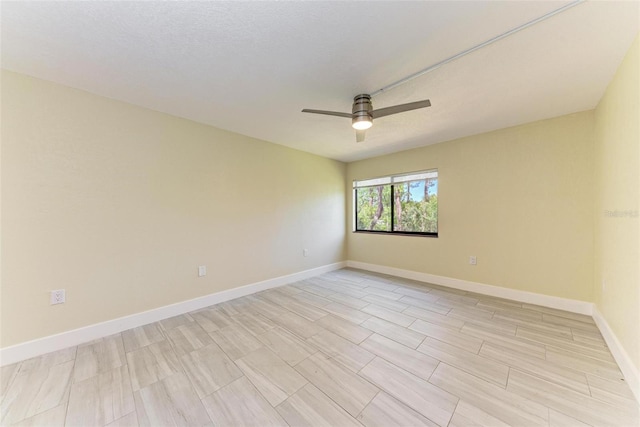2718 Orchid Oaks Dr Unit C-202, Sarasota, FL 34239 - empty room with ceiling fan and light wood-style flooring