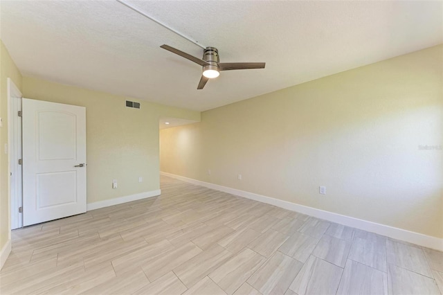 2718 Orchid Oaks Dr Unit C-202, Sarasota, FL 34239 - empty room featuring a ceiling fan and wood tiled floors