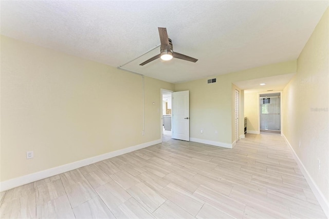 2718 Orchid Oaks Dr Unit C-202, Sarasota, FL 34239 - unfurnished room with ceiling fan and light wood finished floors