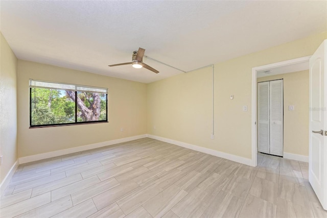 2718 Orchid Oaks Dr Unit C-202, Sarasota, FL 34239 - unfurnished room with a ceiling fan and light wood-type flooring