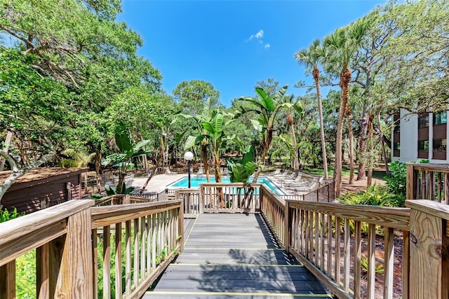 2718 Orchid Oaks Dr Unit C-202, Sarasota, FL 34239 - deck with a community pool and a patio