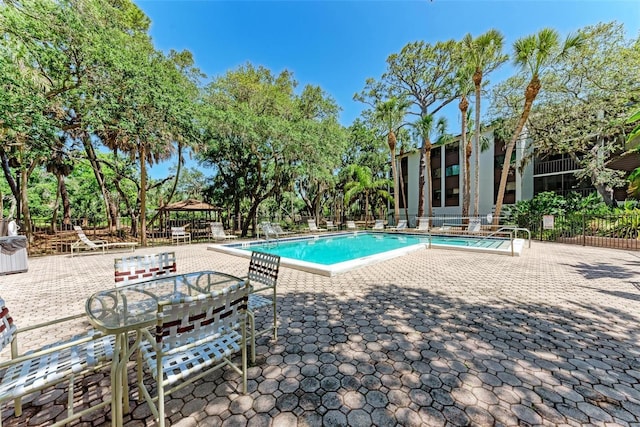 2718 Orchid Oaks Dr Unit C-202, Sarasota, FL 34239 - community pool featuring a gazebo and a patio area