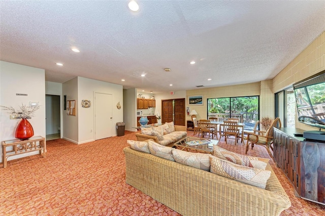 2718 Orchid Oaks Dr Unit C-202, Sarasota, FL 34239 - living area with a textured ceiling, recessed lighting, and light colored carpet
