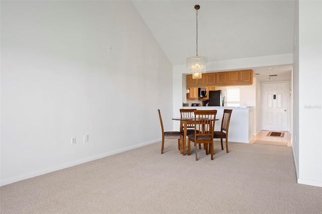 849 Wexford Blvd Unit 849, Venice, FL 34293 - dining room featuring light colored carpet and high vaulted ceiling