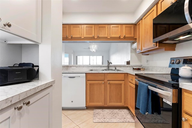 849 Wexford Blvd Unit 849, Venice, FL 34293 - kitchen featuring stainless steel appliances, light tile patterned floors, and light countertops
