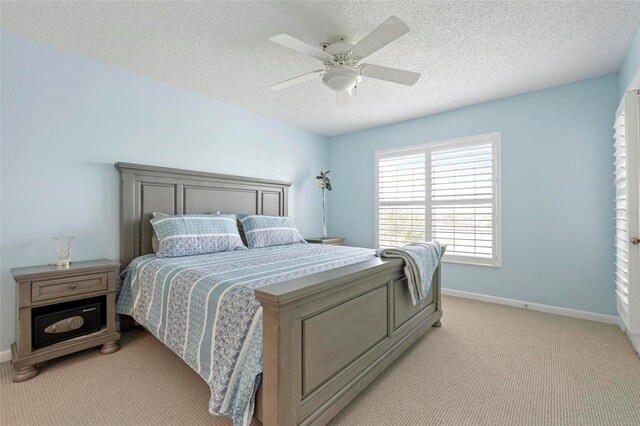 849 Wexford Blvd Unit 849, Venice, FL 34293 - bedroom featuring light carpet, a textured ceiling, and a ceiling fan
