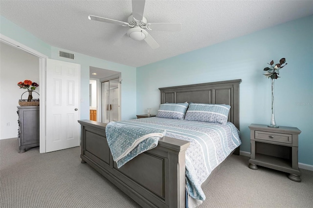 849 Wexford Blvd Unit 849, Venice, FL 34293 - bedroom with carpet, a textured ceiling, a ceiling fan, and ensuite bathroom